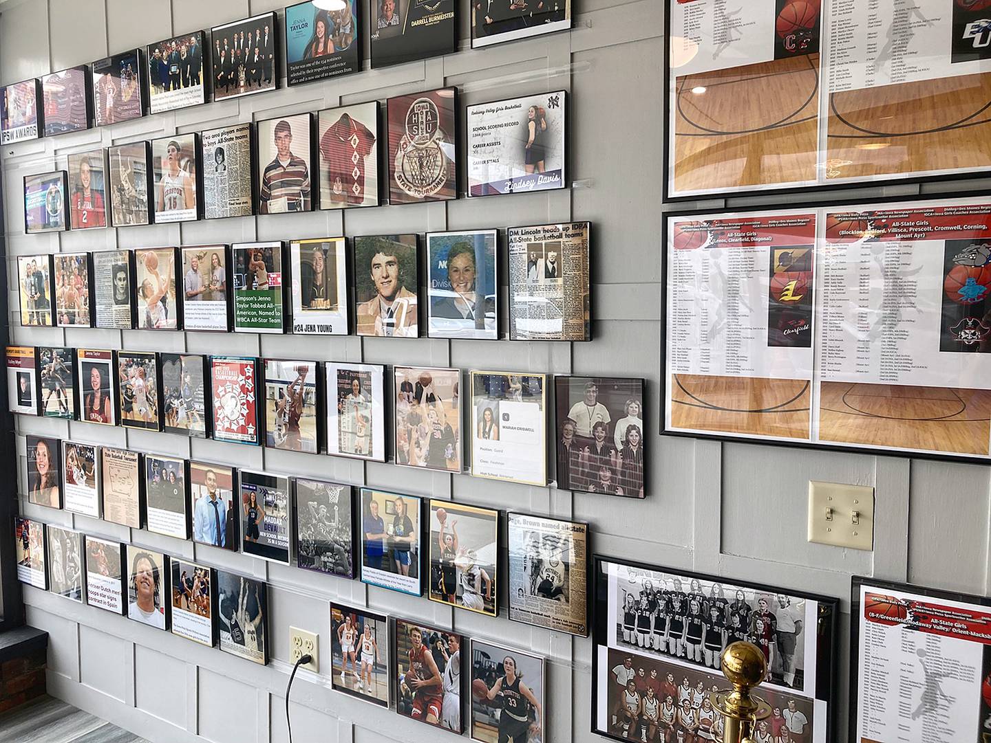 The west wall of the east dining room at Anson's Bar and Grill includes many photos of all-state players and championship teams. Other photos are on the east side along with the center circle from the former high school building, known as the Panther Pit.