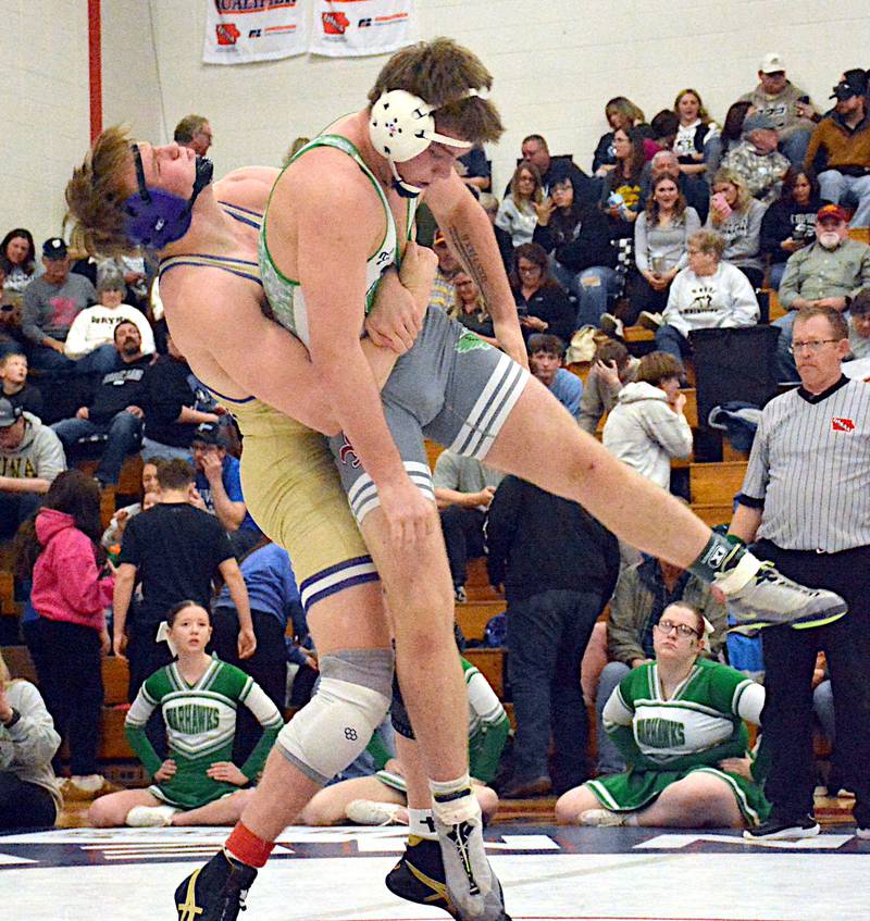 Nodaway Valley 190-pounder Caleb Christensen bear hugs SEW's Tucker Dierking for a mat return in their championship bout, where Christensen reeled off 16 unanswered points for a tech fall.