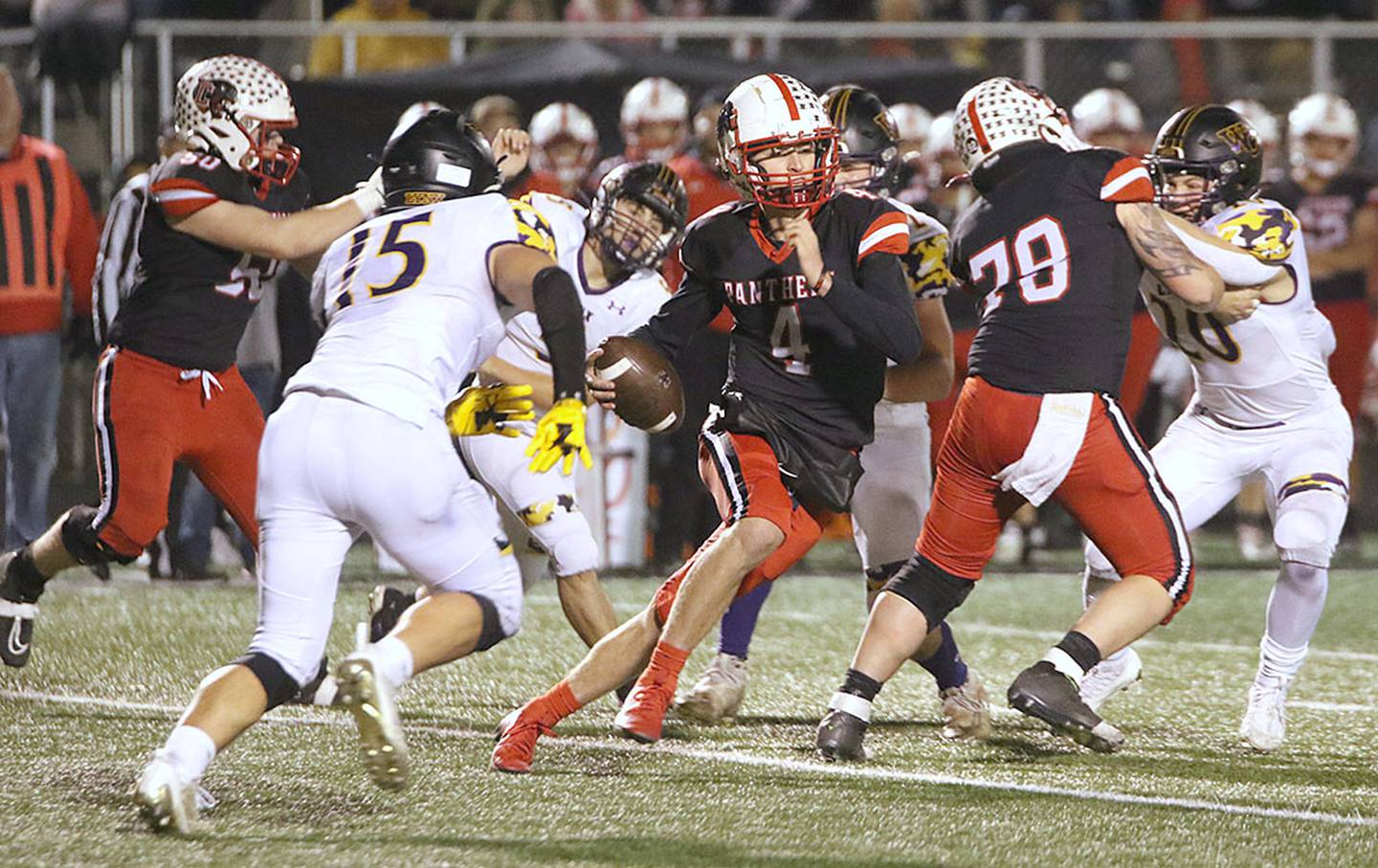 Creston quarterback Cael Turner runs to an opening behind the block of center Jagger Luther (78) during last week's 50-27 victory over Webster City. Turner leads Class 3A in passing with 2,740 yards and 33 touchdowns. Alex Nielsen holds the Creston passing yards record from the 2014 season of 2,868 yards.