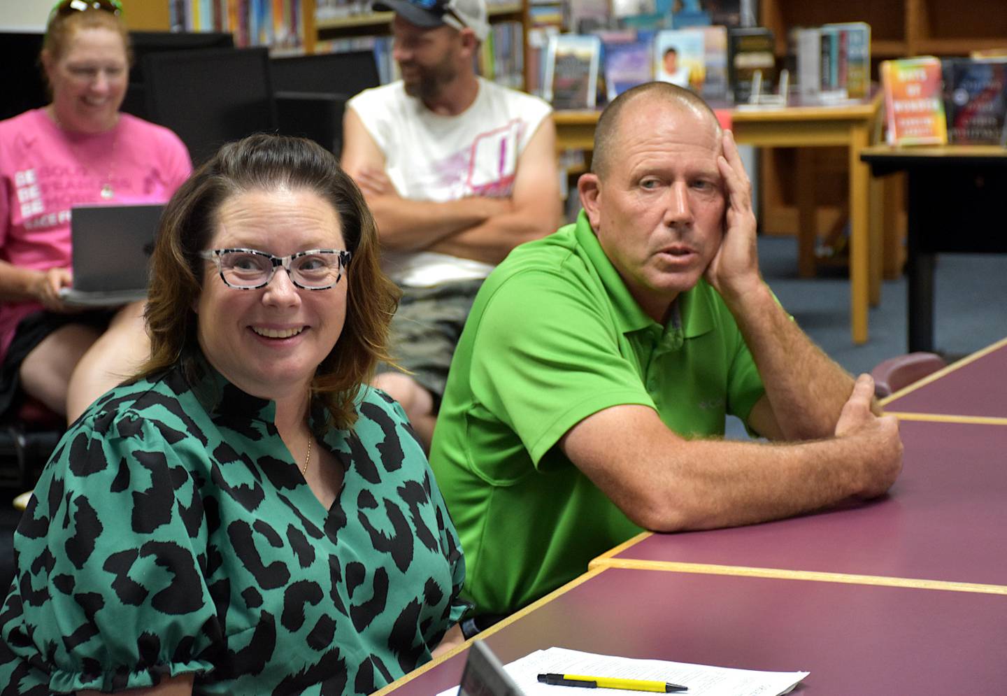 Nodaway Valley school board president Kristen Jensen, left, and superintendent Paul Croghan meet with the Orient-Macksburg dissolvement committee.