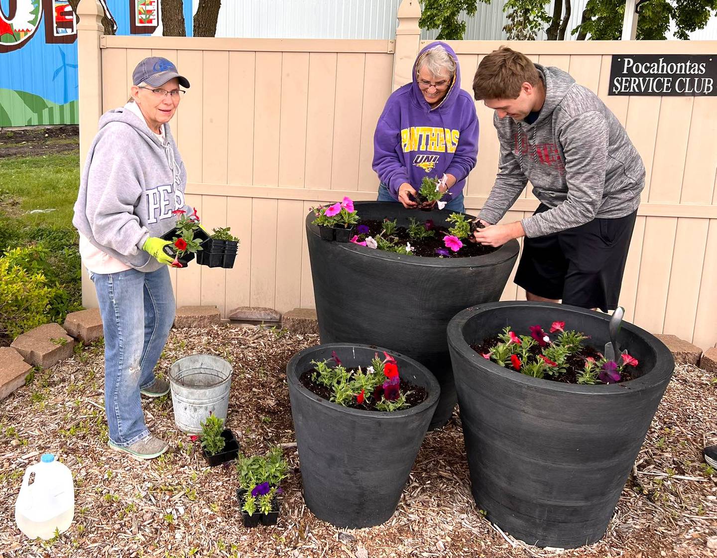 The Hometown Pride committee in Pocahontas plants flowers in their downtown.