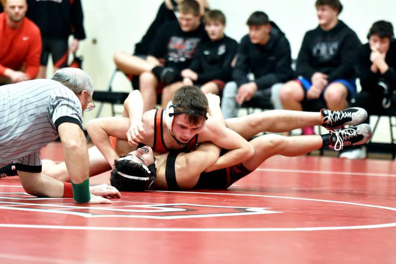 Tyler Travis of Creston pins Harlan's Avery Kimmen Thursday in a home quadrangular with Lewis Central, Harlan and Carroll.