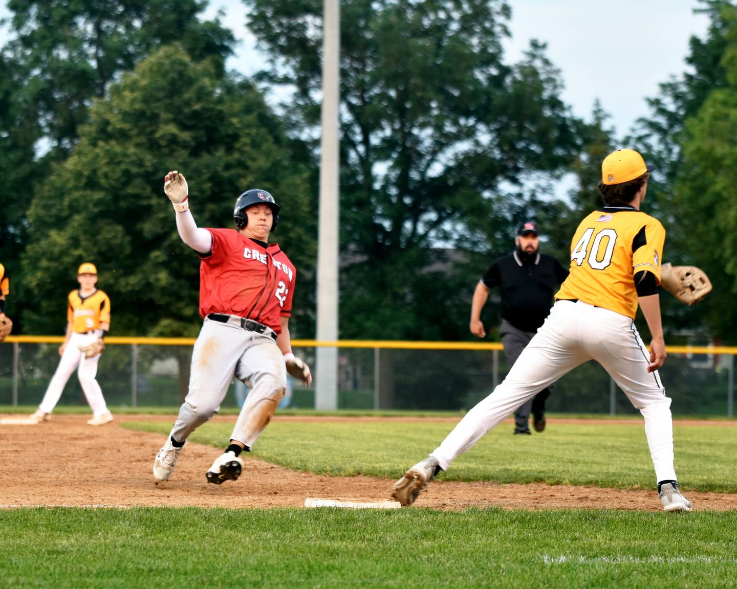 Brayden Schoon slides to third base in a 6-3 win over visiting Atlantic. This is Schoon's first year as a starter on the Creston baseball lineup.