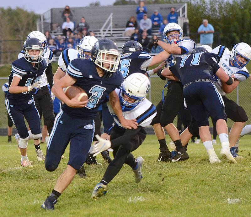 Emmit Long of East Union (3) breaks a tackle against Griswold Friday night. Long rushed for 130 yards and four touchdowns and also returned a kickoff for a touchdown in the Eagles' 57-12 homecoming victory.