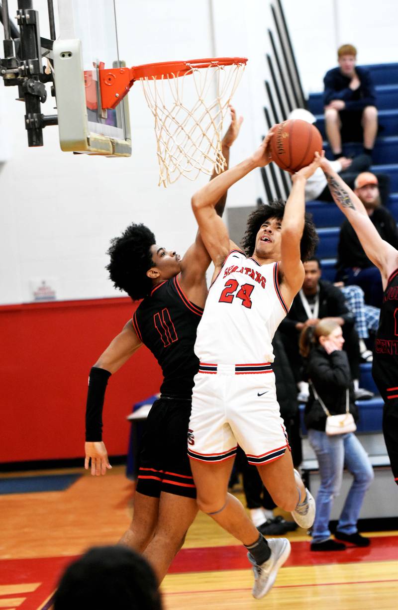 Southwestern’s Andrew Scoggins puts up a shot Wednesday against North Central Missouri College. Scoggins had six points and nine rebounds in the 74-67 victory.