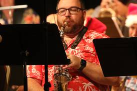 Greenfield sax player helps celebrate Christmas in July