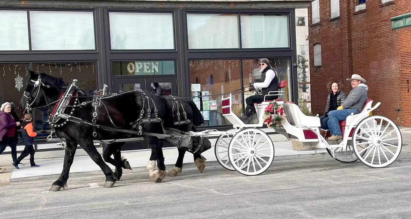 Horse-pulled carriage rides are available during Merry Marketplace.