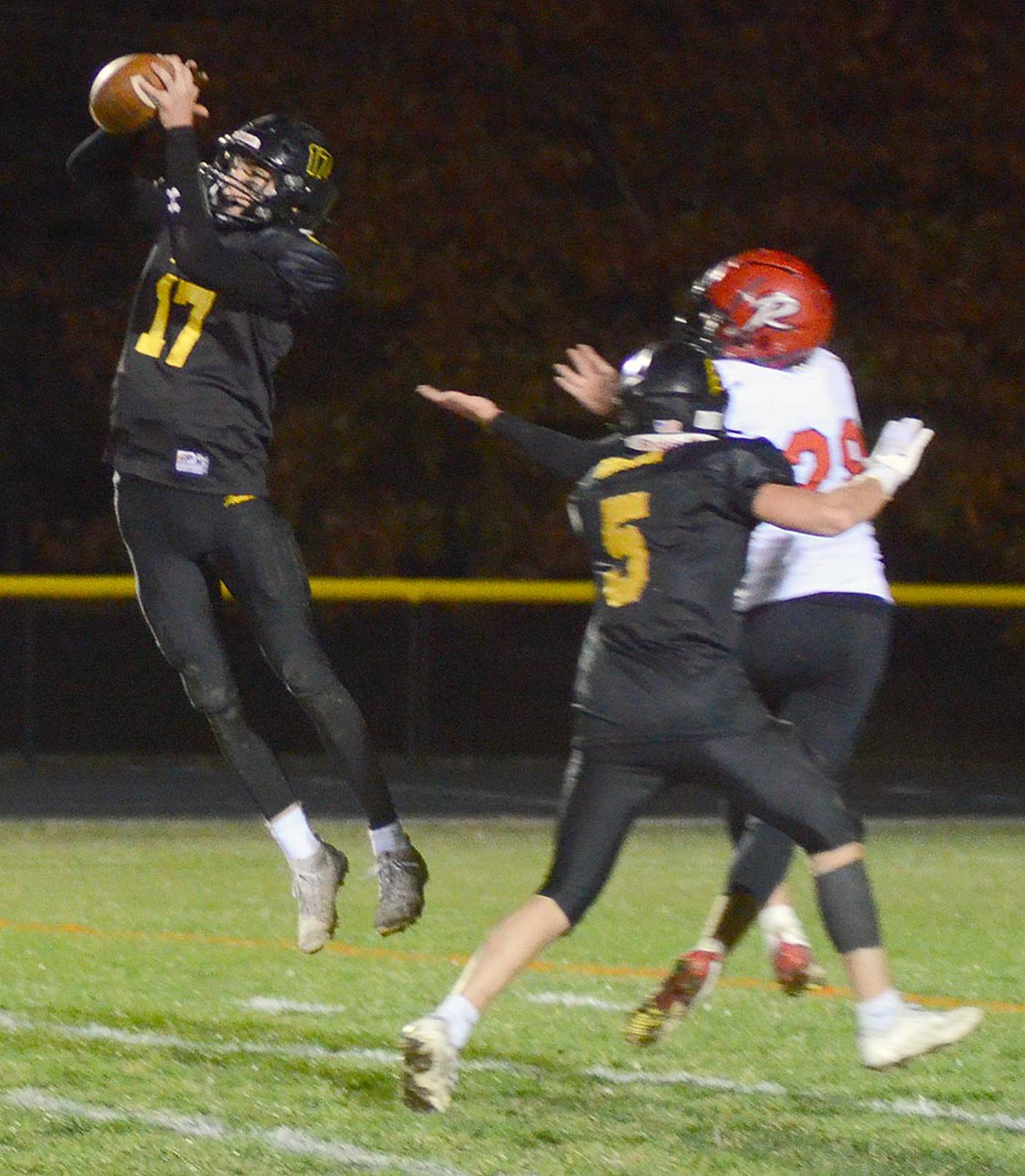 Lenox safety Gabe Funk (17) leaps in front of an Ar-We-Va pass as teammate Kolben Robinson (5) defends intended receiver Wade Ragaller. Funk had two pass interceptions and four rushing touchdowns in the 41-6 win.