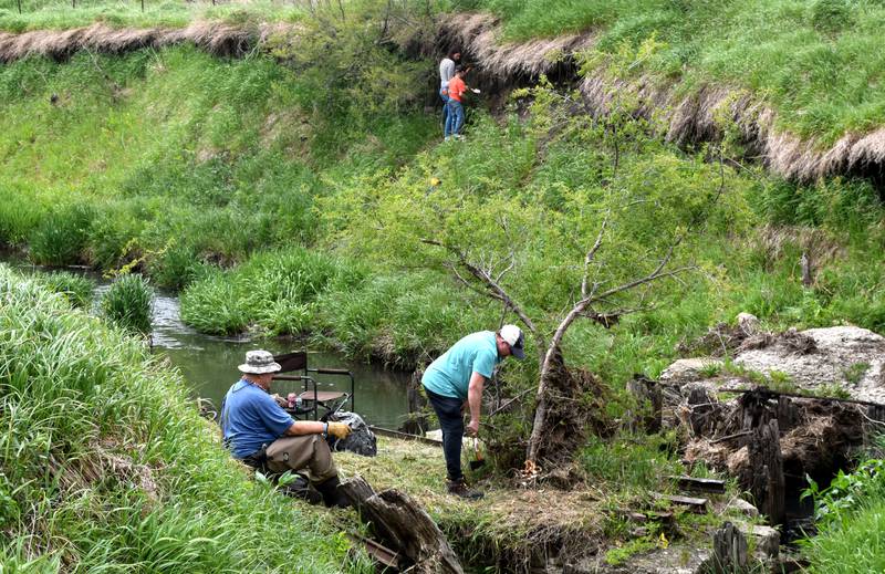 Denny and Vonda Anderson search the tracks and river for artifacts relating to the Jesse James gang's train robbery west of Adair.