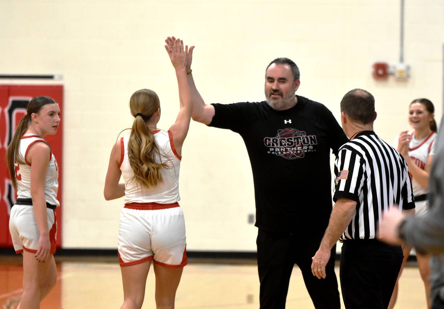 Coach Tony Neubauer congratulations senior Kadley Bailey after a 3-pointer in the second quarter took her over 1,000 career points — a milestone only three other Panthers have achieved in 5-on-5 basketball