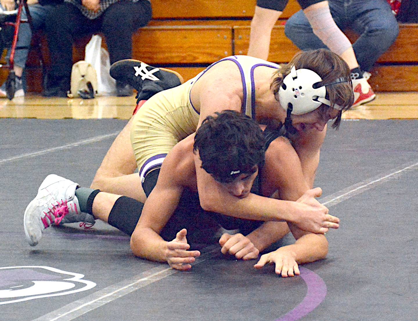 Nodaway Valley junior Jett Christensen breaks down Southwest Valley's Erick West toward an 8-0 major decision win in the 138-pound championship match at the Coach Riley Invitational.