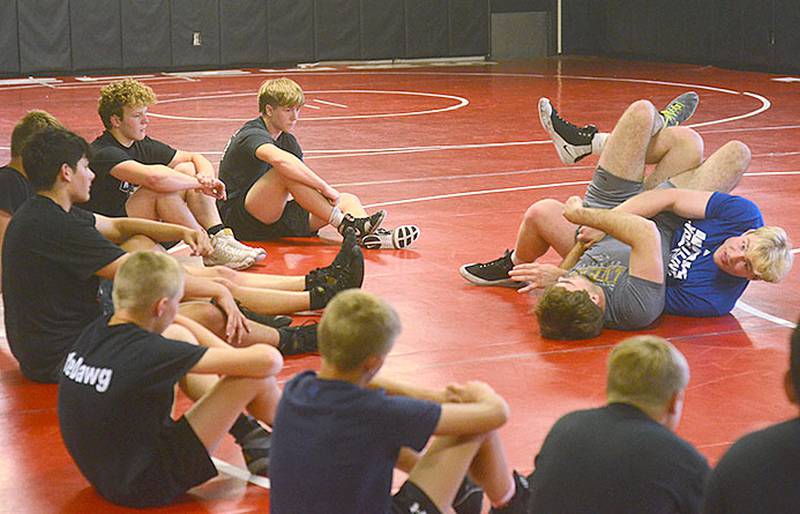 University of Nebraska-Kearney heavyweight Crew Howard of Clarinda (top) demonstrates a pinning combination with UNK teammate Jackson Kinsella of Creston during their two-day clinic at Creston High School.