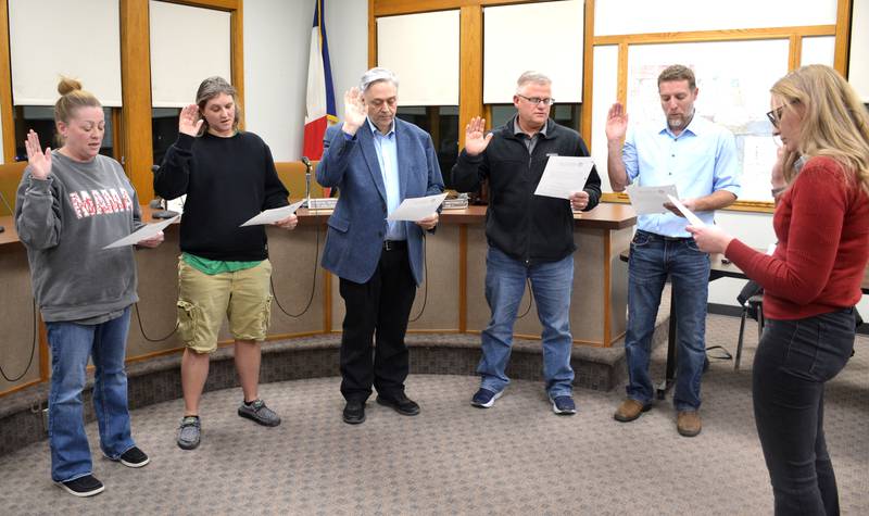 The winners from the city council and special mayoral elections are sworn in Tuesday, Dec. 16 before the city council meeting. All council positions begin in January, while the mayor began his duties that day. From left, Ward 1 Representative Jocelyn Blazek, Ward 3 Representative Jen Worisek, Mayor Doug Daggett, At-Large Representative Toby Henry and Ward 5 Representative Jason Cook, sworn in by City Clerk Brandea Leach.
