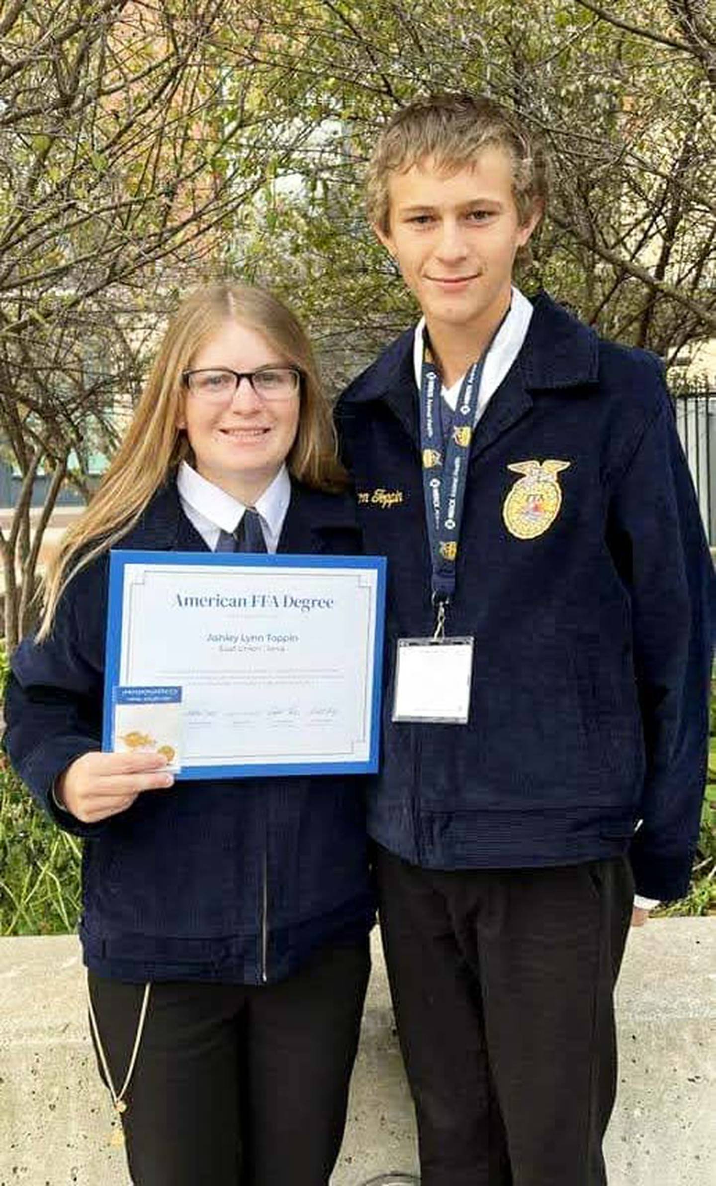 Ashley Toppin with her brother Clayton after receiving her American Degree. Less than one percent of FFA members achieve the American FFA Degree. Each recipient is recognized at the national convention.
