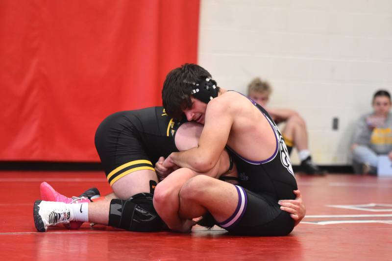 NV's Derek Raasch looks for control, facing AJ Christner of Eddyville-Blakesburg-Fremont Saturday at the Creston Invitational.