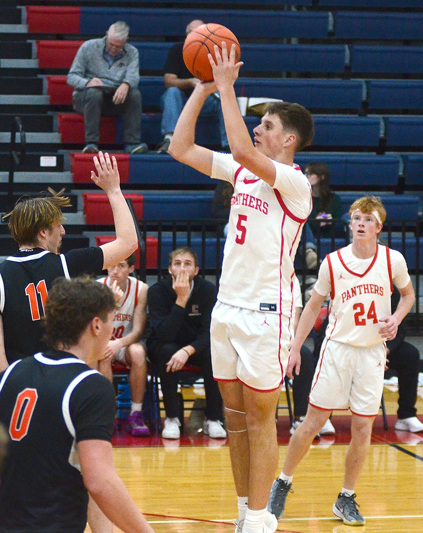 CT Stalker of Creston rises above Madrid's Emerson Bridgewater for a shot Thursday night. Stalker had a team-high four assists and two points in the loss.