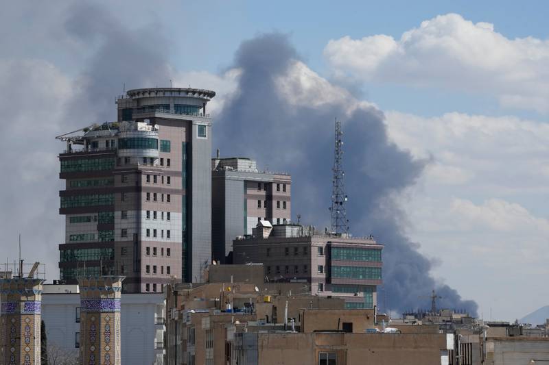 Smoke rises up after a strike in Tehran, Iran, Sunday, March 1, 2026. (AP Photo/Vahid Salemi)