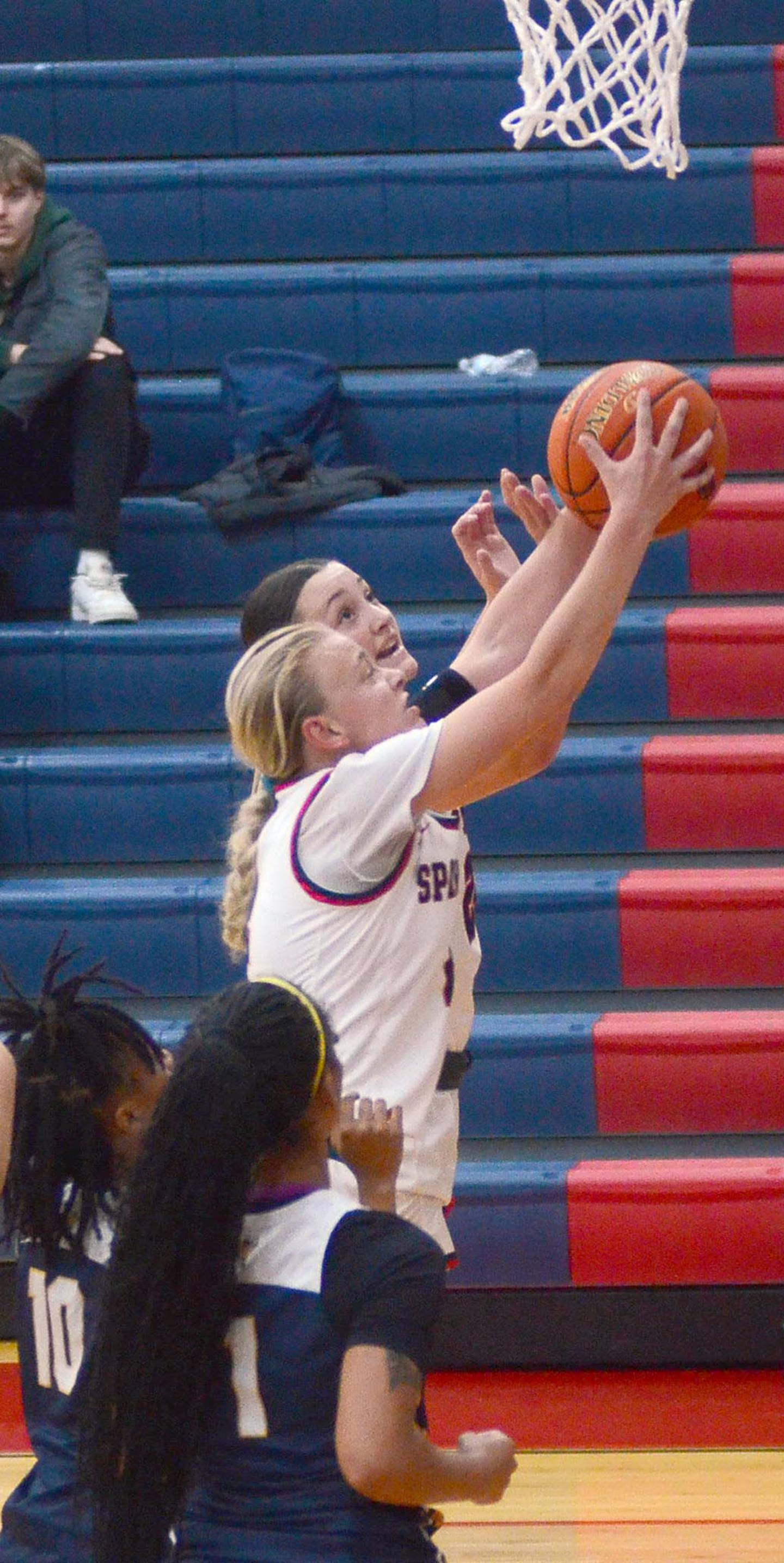 Southwestern guard McKenna Wiechman grabs a defensive rebound during Tuesday's home opener. The sophomore guard from Griswold scored four points.