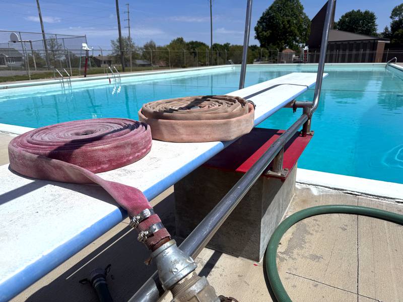 Extra hose sits on the low diving board at the Greenfield swimming pool as it fills for the upcoming 2026 season, which right now, is slated to begin June 2.
