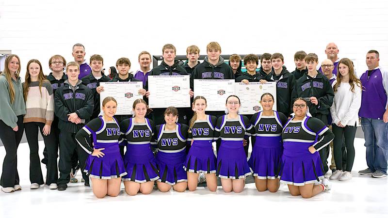 Cheerleaders, managers, coaches and wrestlers for Nodaway Valley/OM celebrate a win in the Pride of Iowa Conference Tournament at Corning.