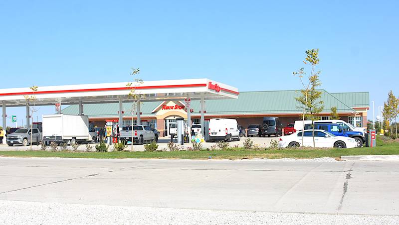 Happy customers fill the parking lot at the Kwik Star store on the south side of Stuart late morning Thursday, Oct. 10, which was the store's opening day. The store is on the east side of Stuart Road on the south side of Interstate 80.