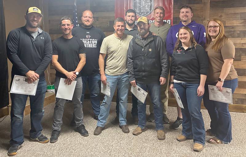 Members of the 2007-08 Creston/O-M wrestling team inducted into the Creston Wrestling Hall of Fame Saturday included, from left in front, Trent Tucker, Zac Leith, Quin Leith, Bret Kautz, Summer (Sistad) Young and Kristina (Adamson) Winkler. Back row, Casey Tanner, Jared Bevins, Jesse Harris and Tanner Royster. The team placed second behind Ballard in both the state dual tournament and traditional tournament, scoring the eighth-highest point total (139) in Class 2A history.