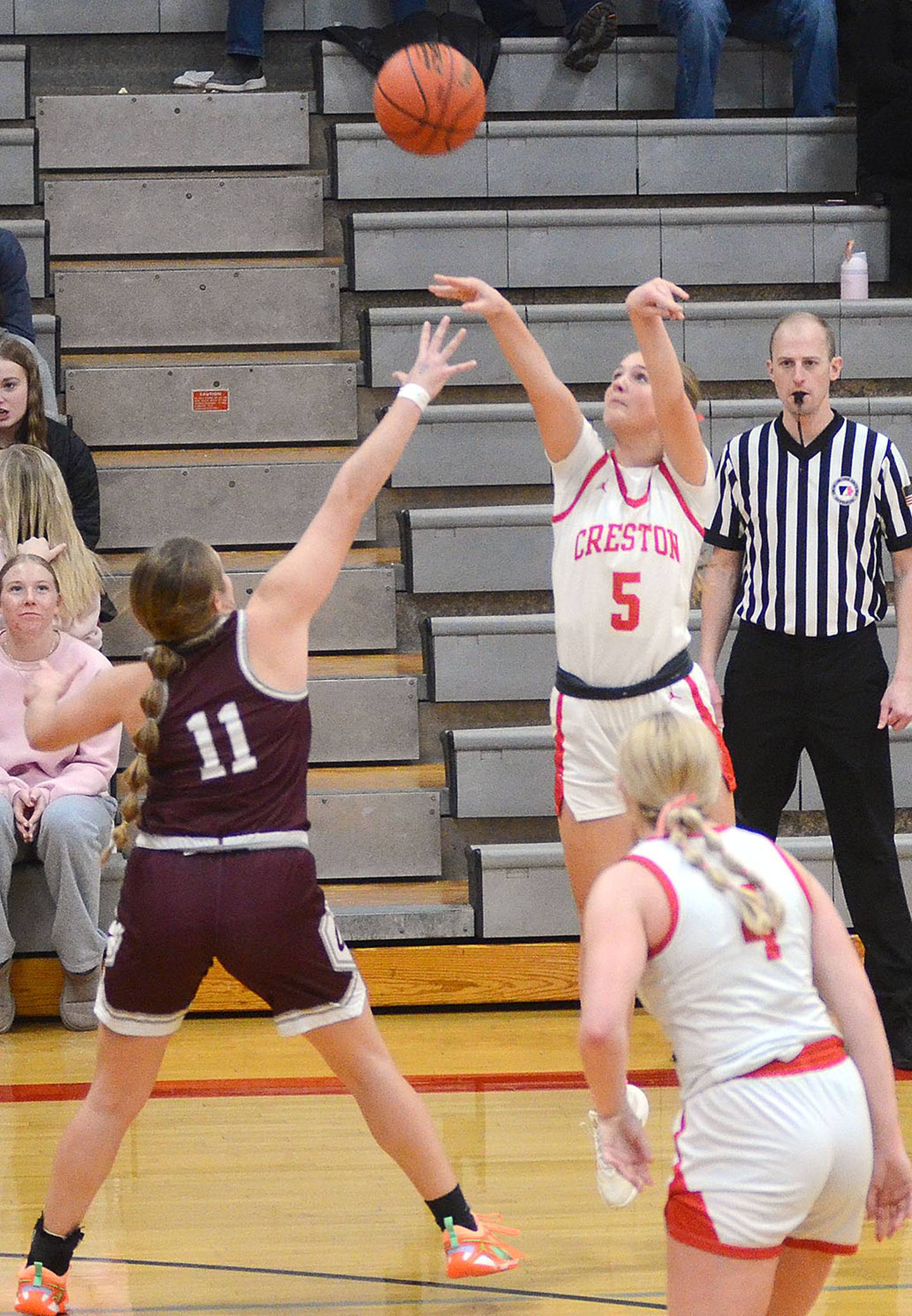 Marlee Stalker of Creston shoots a 3-pointer against Clarke Saturday. Stalker made three 3-pointers in scoring 11 points in the first half of the 58-46 win.