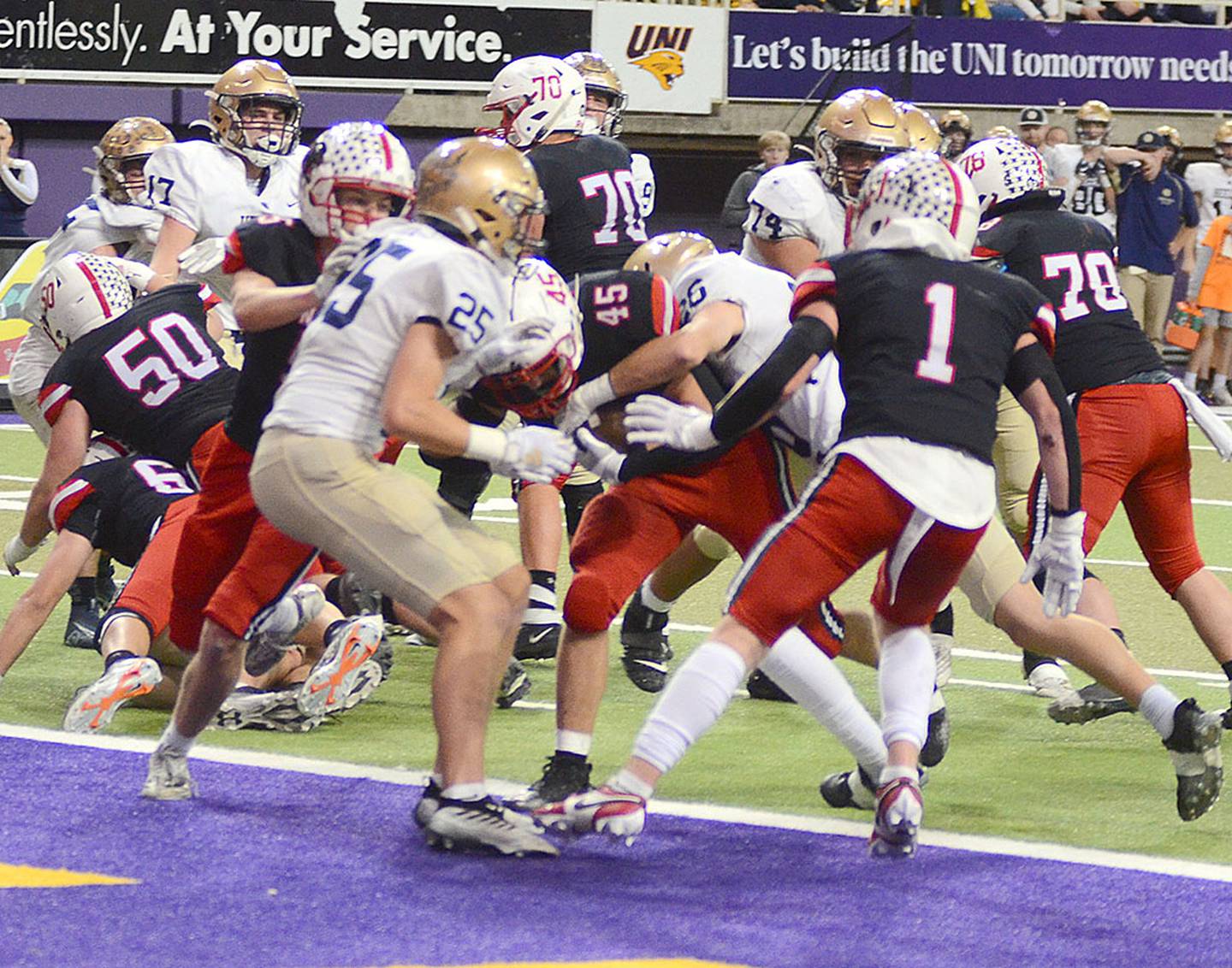 Brennan Hayes of Creston (45) scores on a 2-yard run for Creston's first touchdown in Saturday's 16-13 loss to Bishop Heelan. Hayes rushed for 136 yards and had 56 yards receiving on three catches. He ended the season with 1,781 yards rushing (second in Class 3A) and stands second in Creston career rushing with 3,806 yards.