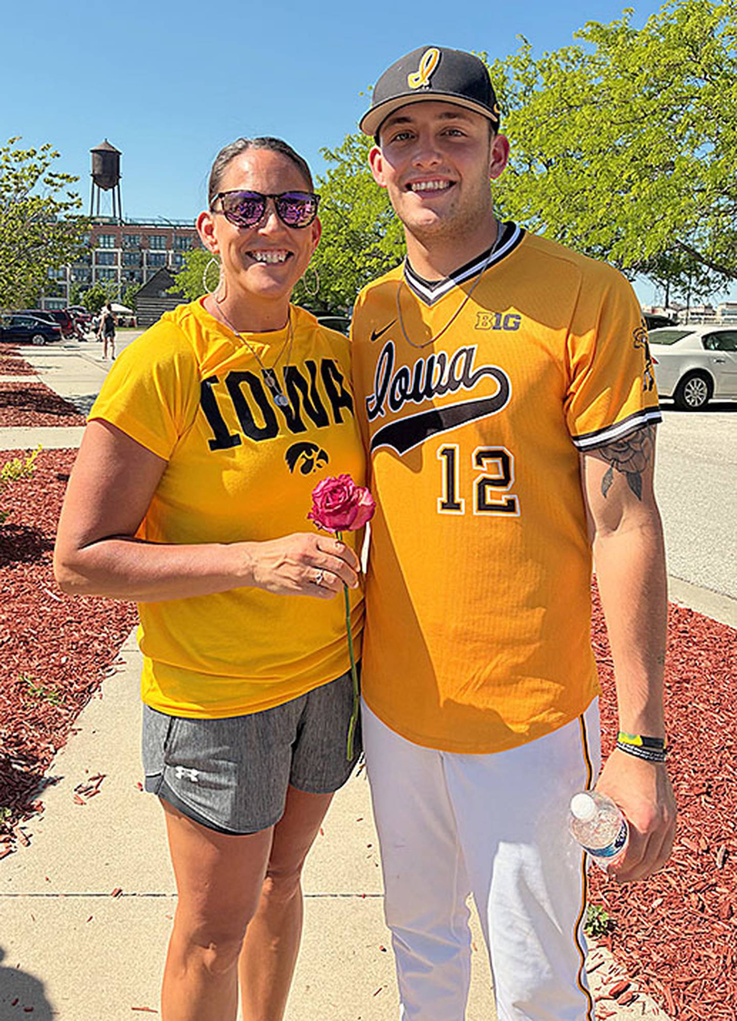 Jaixen Frost of Mount Ayr is shown with his mother, Jolene Frost, after the Mother's Day game Sunday at Principal Park. Players presented a rose to their mother prior to the game.