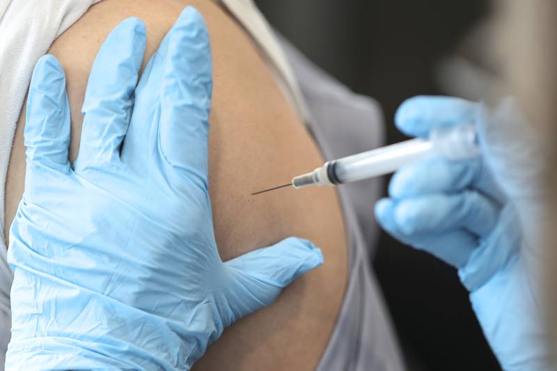 A patient receives their second dose of the Moderna COVID-19 vaccine on Wednesday, Feb. 10, 2021, at the Will County Health Department in Joliet, Ill. The Will County Health Department is accelerating vaccination efforts throughout the region.