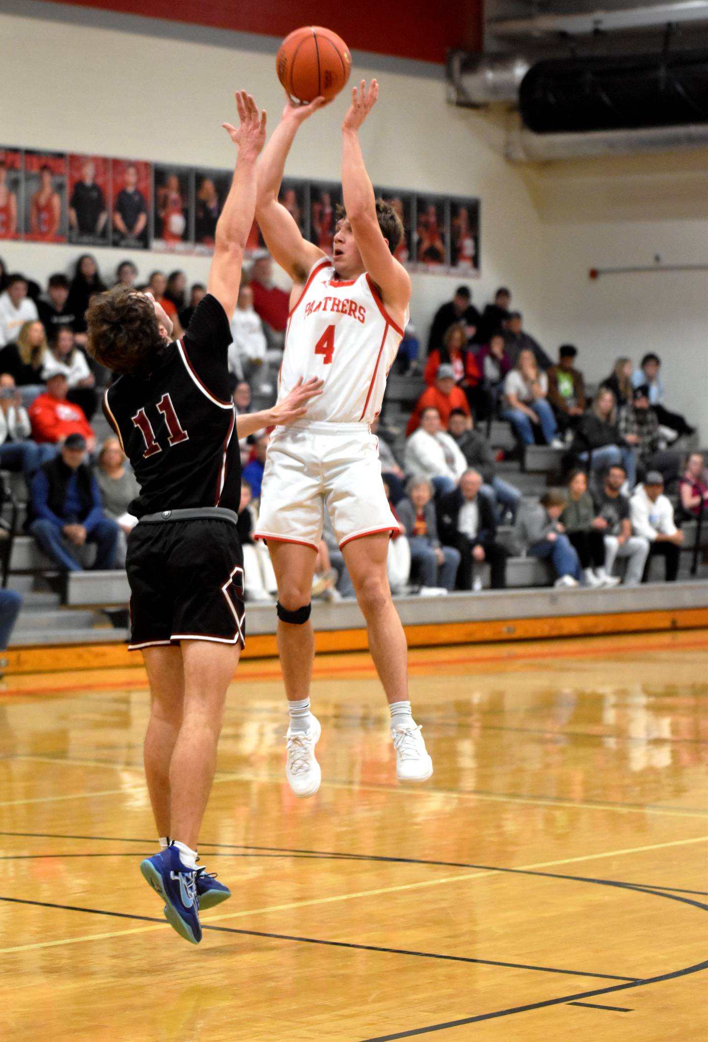 Creston senior Cael Barton goes up for a mid-range jump shot against Clarinda defender Cooper Baumgart.