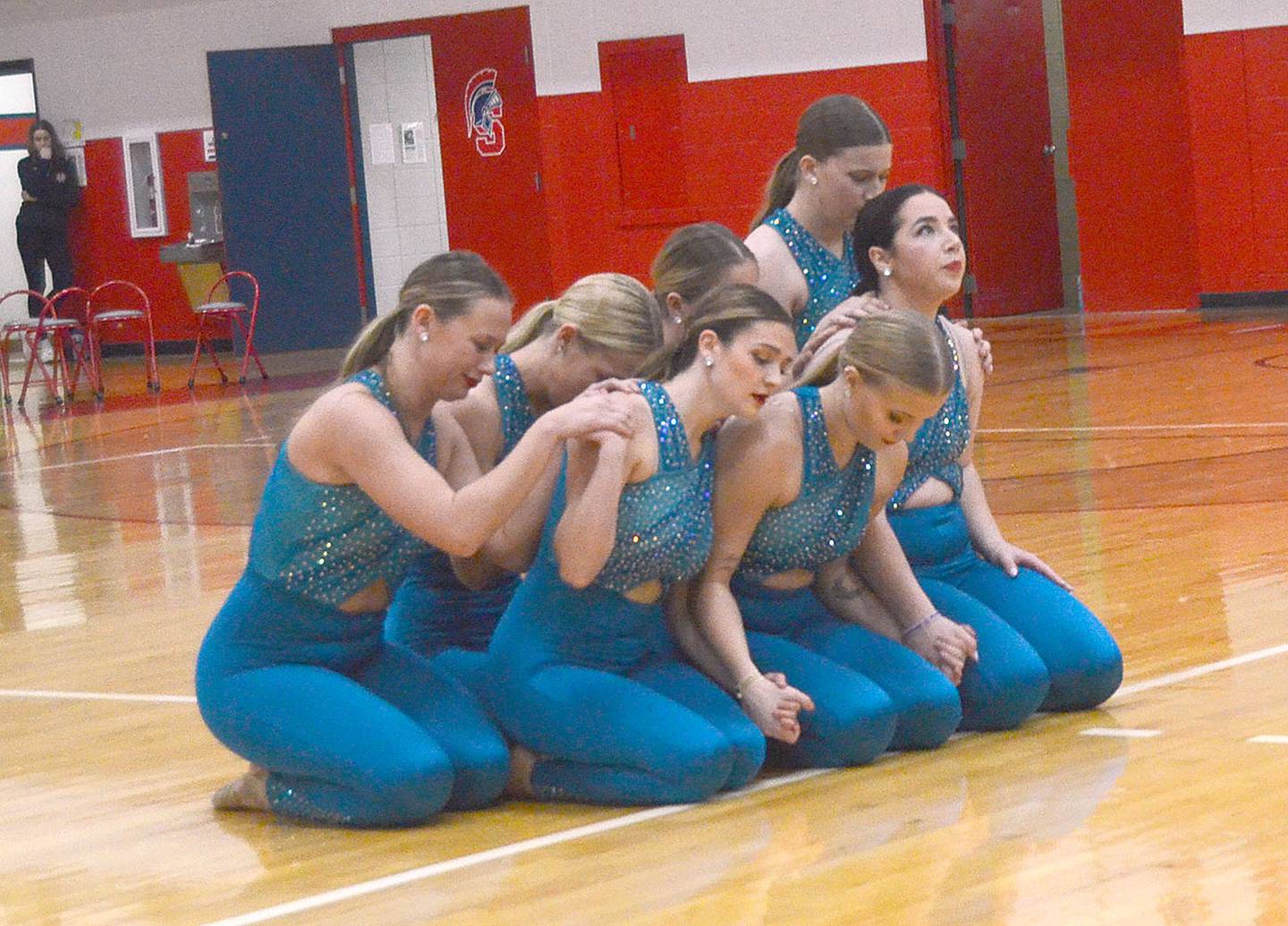 The Spartan Dance Team concludes its tribute dance, "In the Stars," to former members Maddie Stewart and Ella Leonard during halftime of Monday's game. Coach Paige Russo directed the performance.