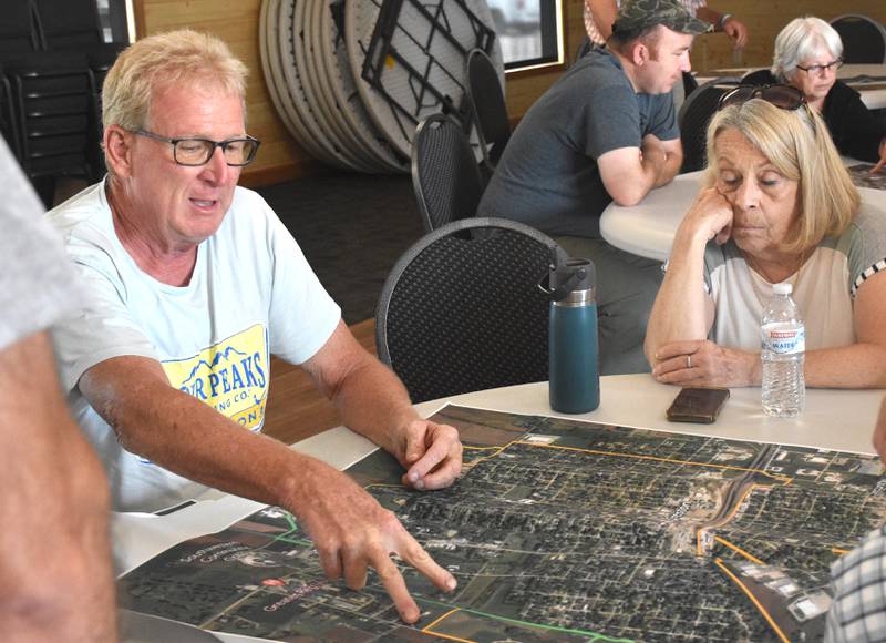Jon Carroll and Ellen Gerharz mull over possible additions and improvements to trails in Creston.