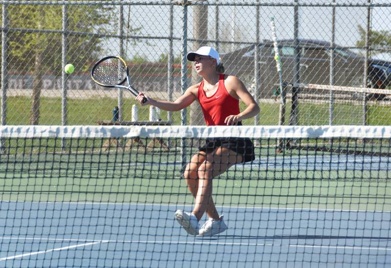Creston senior Ava Adamson rallies with Boone’s Kaylee Kuehl in the No. 1 singles match Monday in Creston.