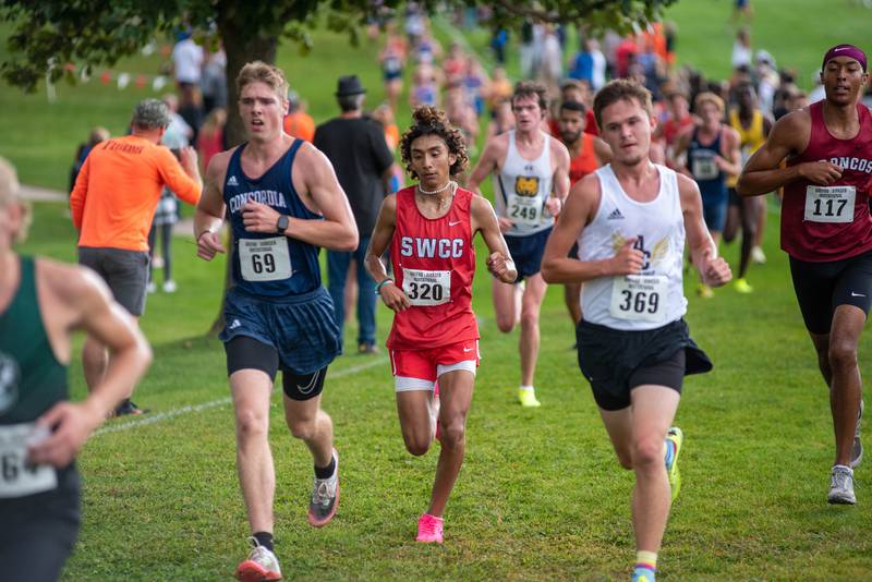 Southwestern freshman Daemon Rodriguez, center, joined sophomore Chase Oates in running a national-qualifying time under 28 minutes, running 27:42 Saturday at the Greeno/Dirksen Invite, co-hosted at Mahoney Park Golf Course by Nebraska Wesleyan University and University of Nebraska.