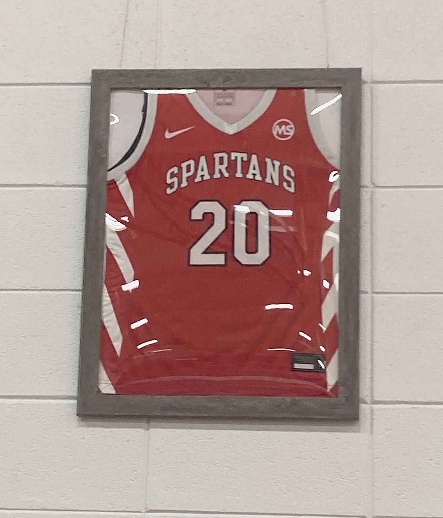 Maddie Stewart's No. 20 jersey was retired and hung on the west wall of the Spartan Gymnasium prior to Monday's game.
