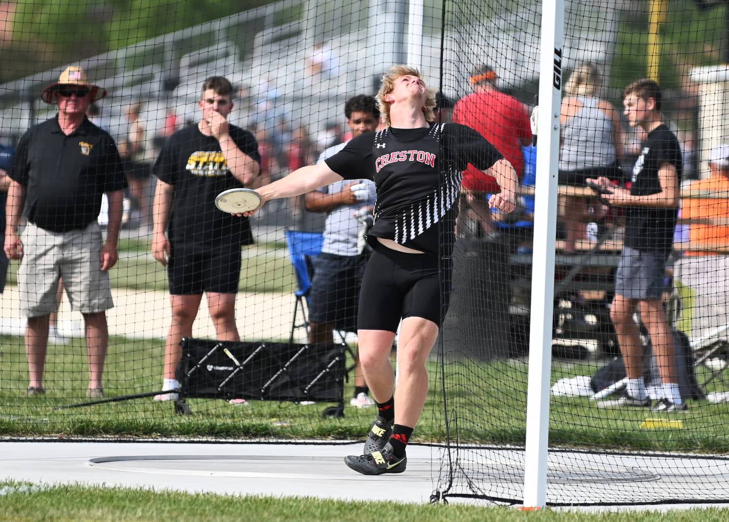 Tom Mikkelsen lets the discus go in an attempt Thursday. He qualified in shot put and discus.