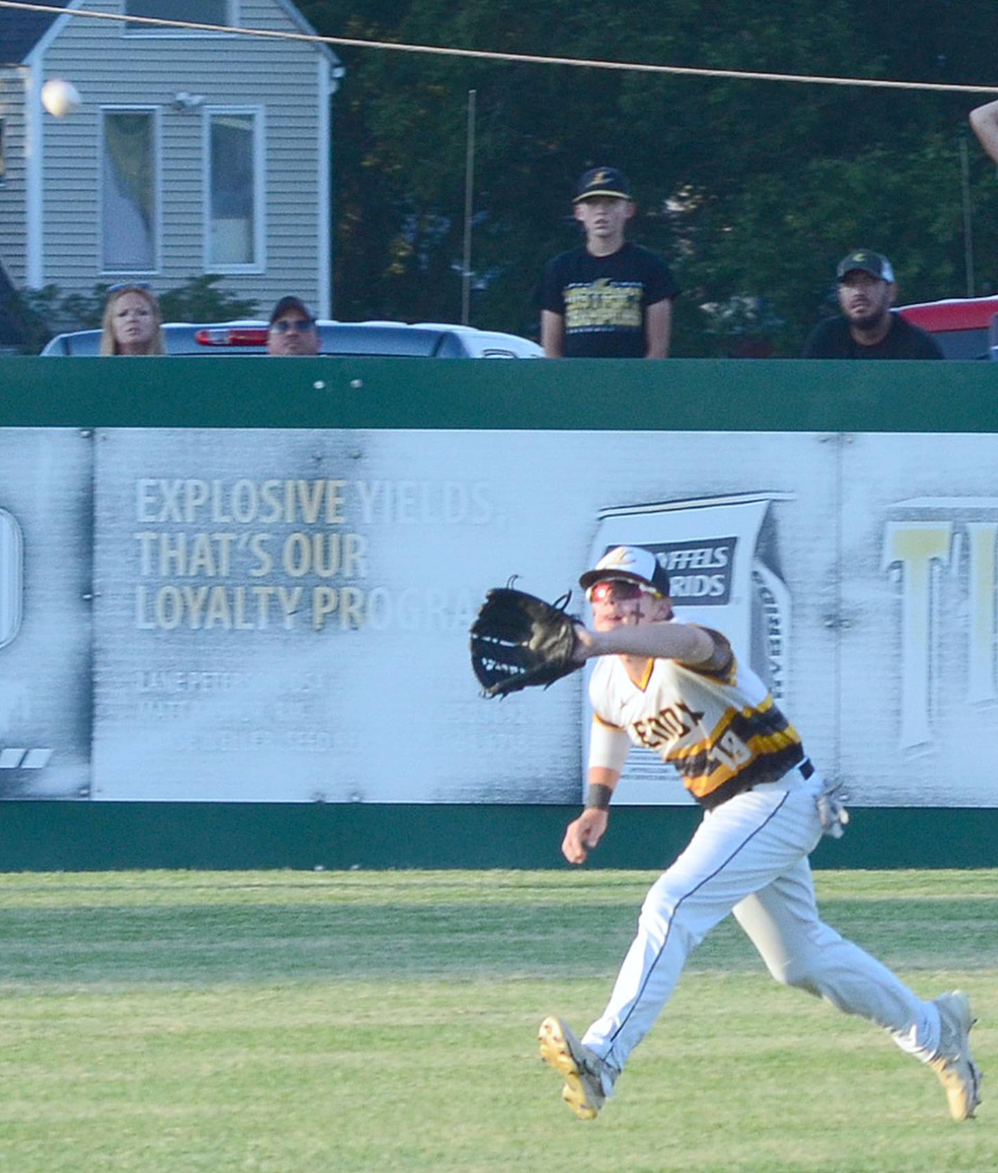 Left fielder Caleb Menefee  tracks a flyball during Lenox's 4-0 district tournament victory over St. Albert Tuesday night.