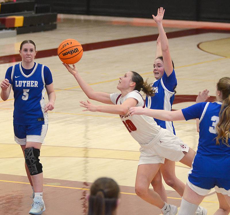 Maddax DeVault drives to the basket against Luther Tuesday night. DeVault had a team-high 18 points.