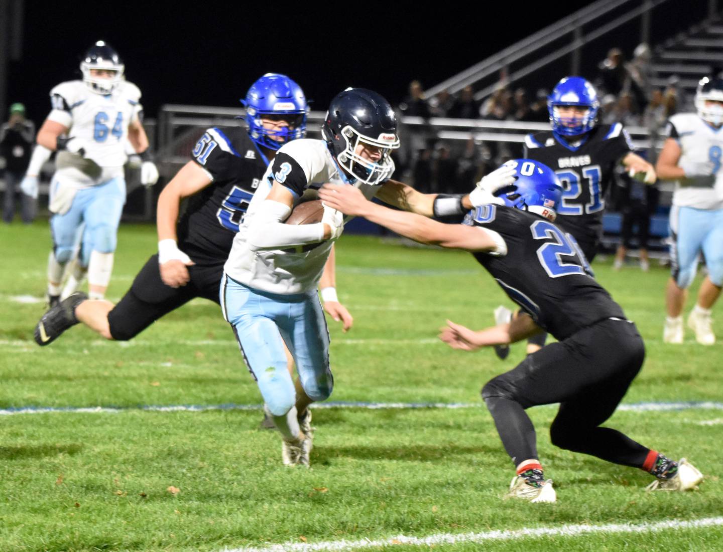 Eagles senior Paul McNeill (No. 3) stiff-arms Montezuma defender Broox Stockman on a catch-and-run. McNeill had eight receptions for 82 yards and two touchdowns Friday against the Braves.
