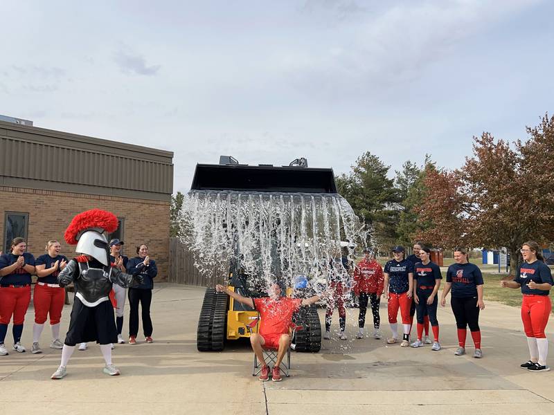Spartan head softball coach Danny Jensen with his winning splash in the second annual #DunkdChallenge.