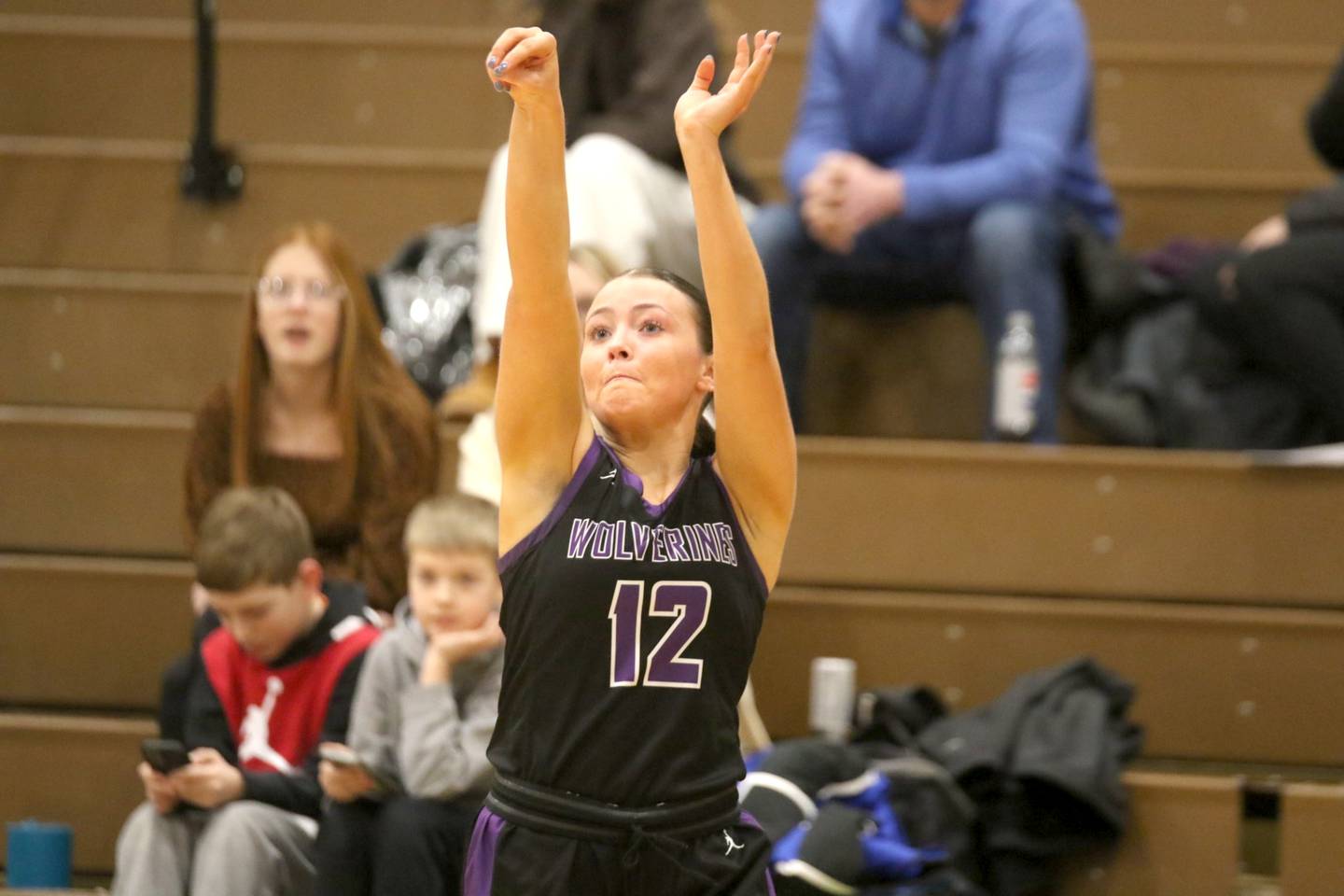 NV senior Liv Laughery rises up for a jump shot in a regional tournament girls basketball game against Shenandoah.