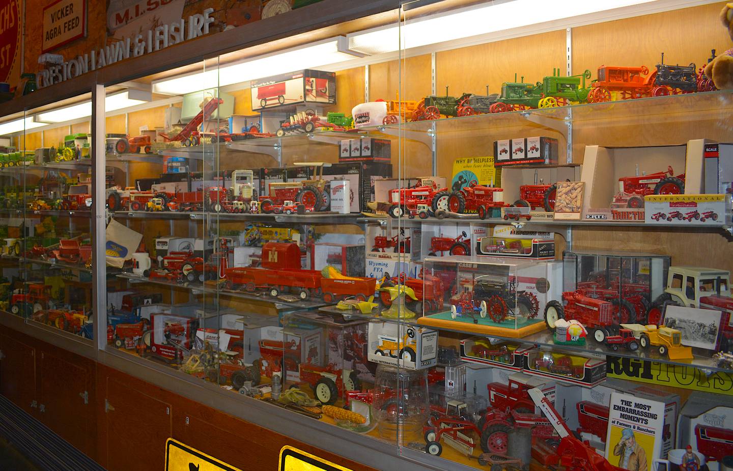 A display case at the Miller's emporium, holding trinkets, tools, toys, booklets and other unique pieces of agricultural history. These items arrived to the Millers from all over the world. Each has a history and a story to tell.