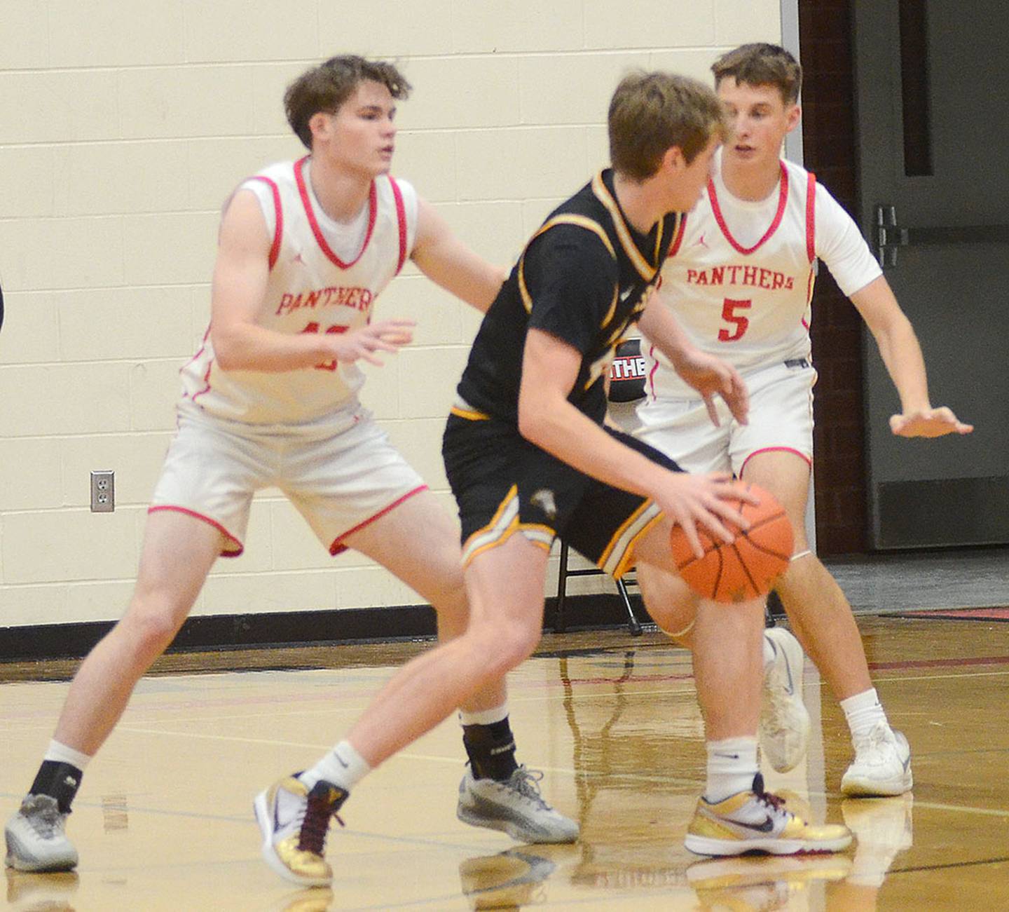 Ayden Purdum and CT Stalker play defense Monday against Winterset.