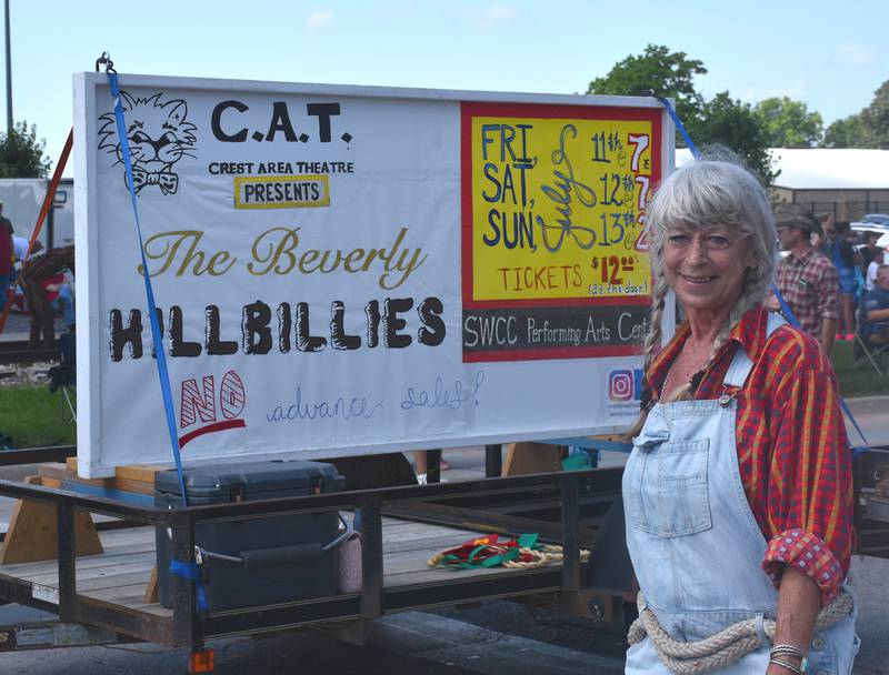 Linda Stewart helps CAT drum up support for their production "The Beverly Hillbillies" during the Fourth of July parade.