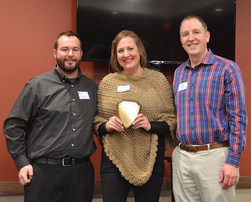 Corey and Colleen Conrad of West Des Moines are presented the Entrepreneurial Impact Award by Matt Wedemeyer for their ongoing efforts to help revitalize downtown Casey. Their latest endeavor has been Tin Lizzie's Sports Bar, an extension of Pioneers Pub and Grub.