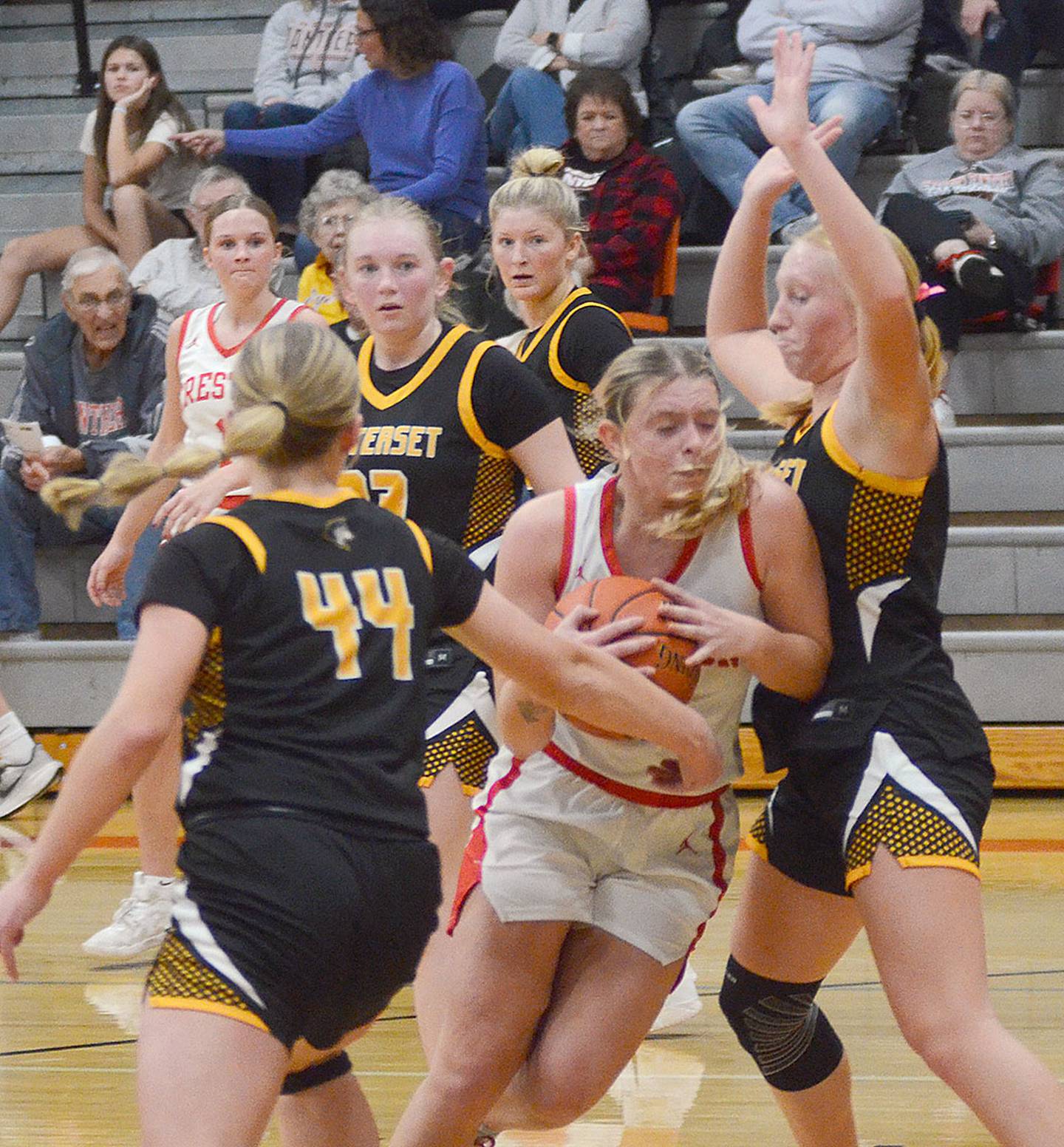 Creston's Ella Turner drives through a crowd on her way to the basket against Winterset. The Panther senior had 18 points, six rebounds and three steals in the loss.