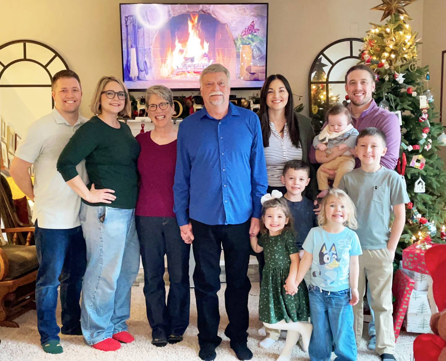 Larry Peterson, center, with wife Deb, children and grandchildren during Christmastime.