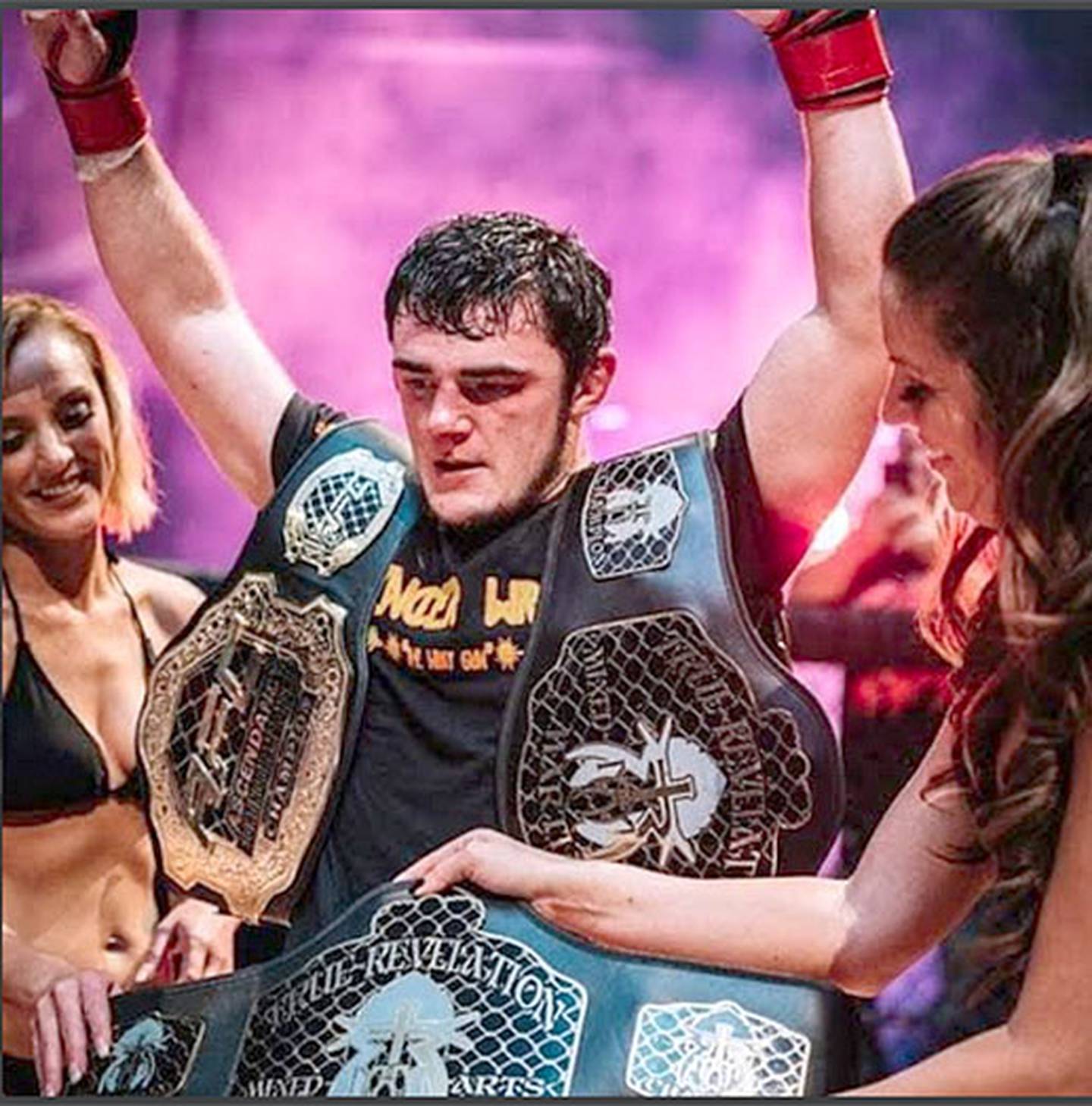 Spencer Wray is awarded a championship belt after winning a True Revelation Mixed Martial Arts title fight.