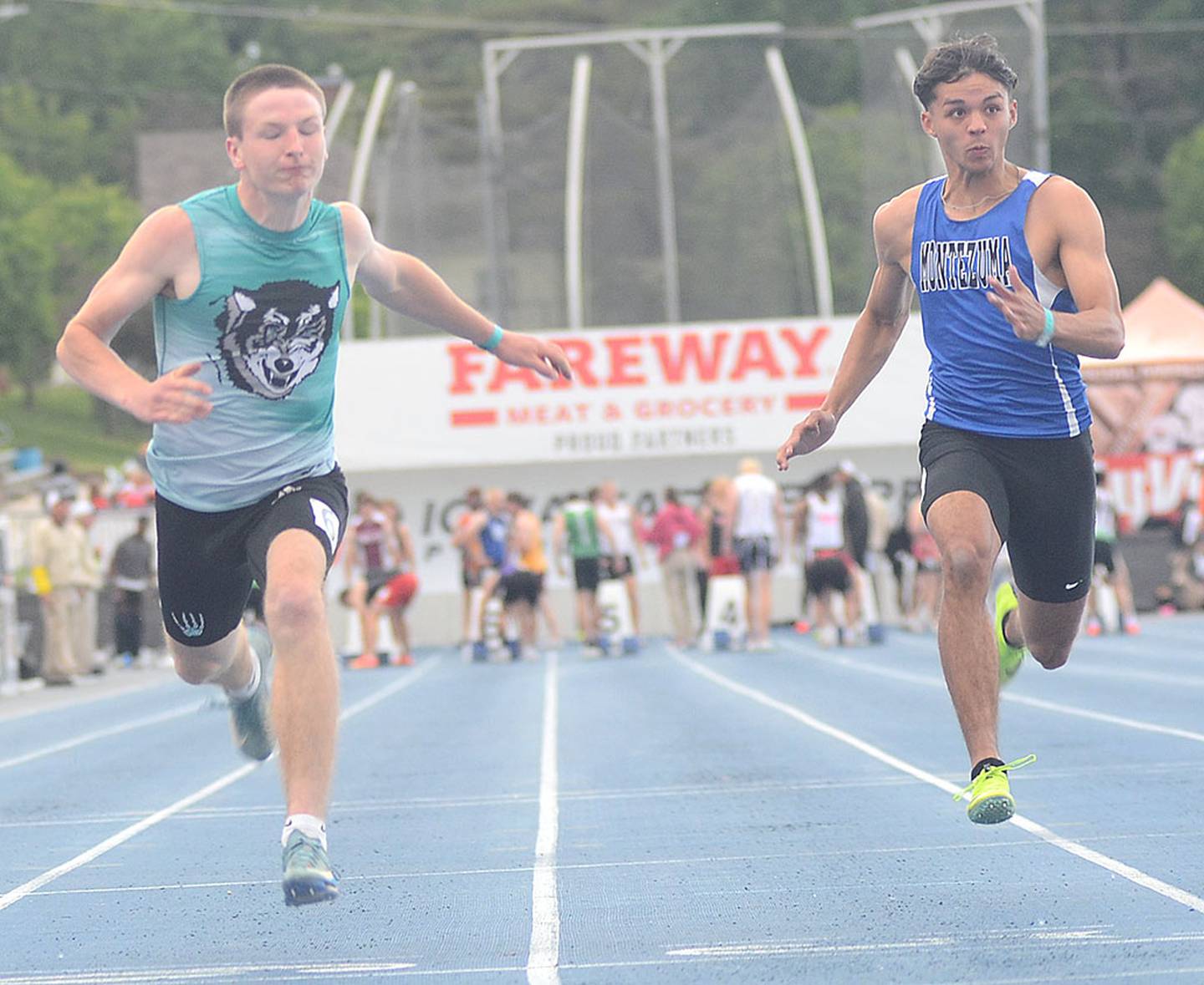 Brody Crozier of Southwest Valley (left) runs in the 100 meters at the state meet Thursday. Crozier ran a school-record time of 11.22, missing the finals by .02 of a second.
